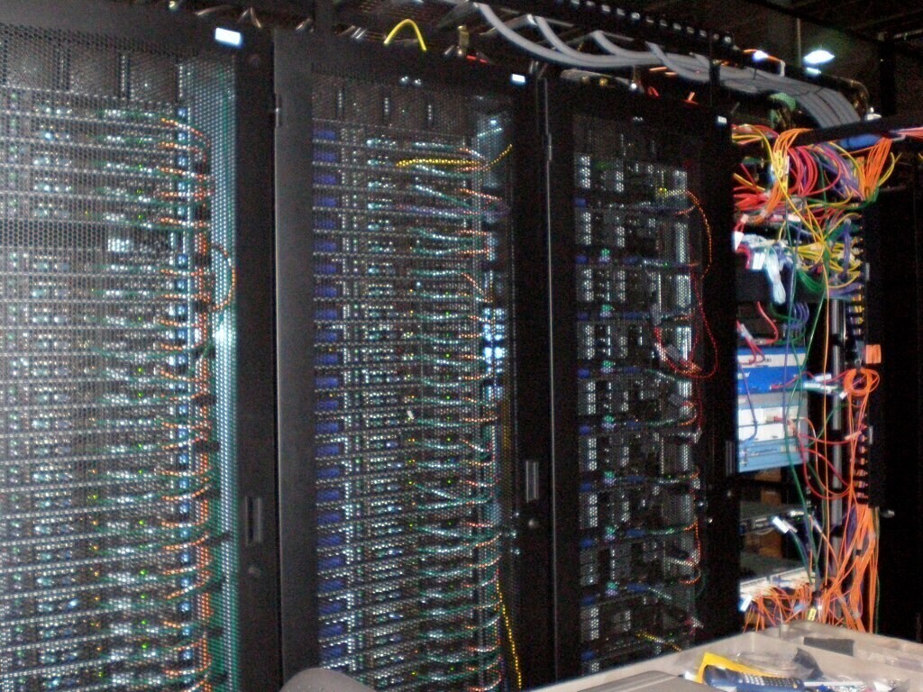 Rack servers in a Data center. "Data Center" â Just some servers in a data center. Sean Ellis, licensed under CC BY 2.0.
